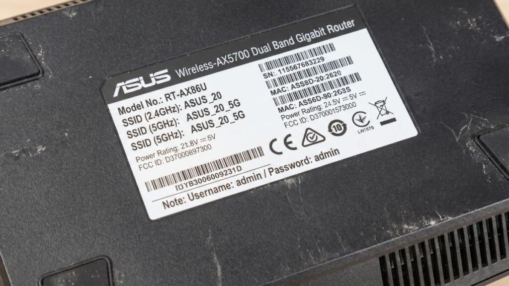ASUS RT-AX86U router bottom sticker showing default SSID username and admin password